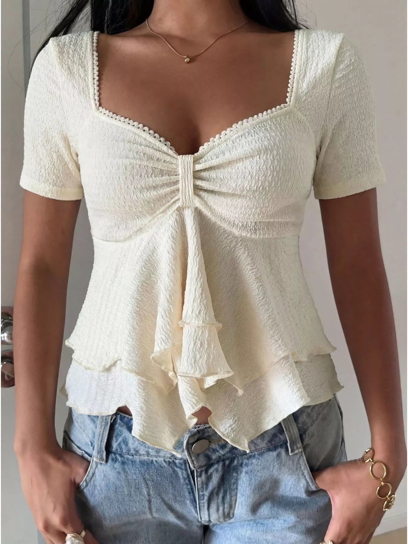 White sweetheart neck layered ruffle top from Trendsi, featuring a feminine design with layered ruffles and a fitted silhouette.