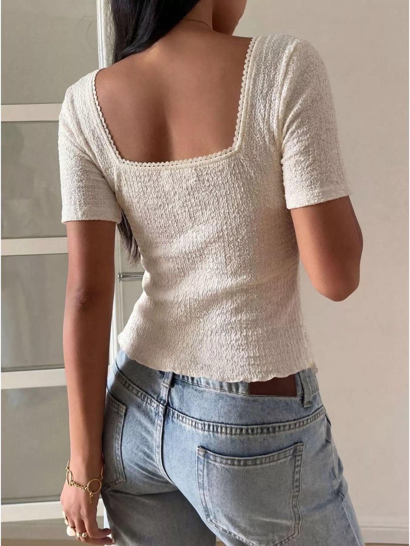 White sweetheart neck layered ruffle top from Trendsi, showcasing the feminine neckline and layered ruffle details.