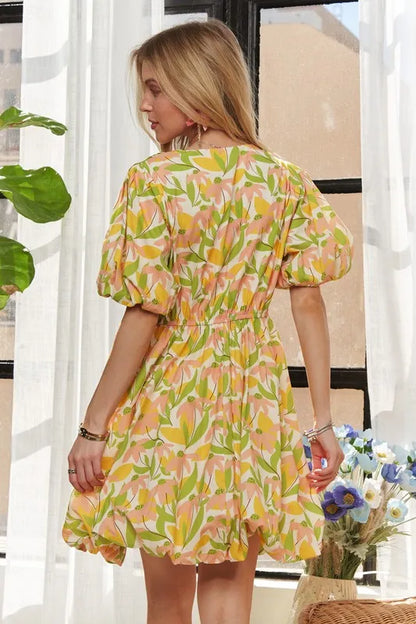 Yellow ADORA puff sleeve floral dress by Trendsi, featuring a flowy silhouette and vibrant floral pattern.
